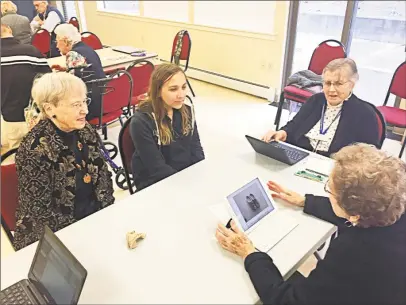  ?? Contribute­d photos ?? Victoria Gorski, a Cromwell High School student, is part of the monthly iHelp team that gives tech tips to seniors at Covenant Village in Cromwell, including, from left, Eunice Wiseman, Louise Butts and Lois Blomstrann.