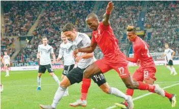  ?? — AFP ?? Germany’s Nico Schulz (left) and Peru’s Luis Advincula vie for the ball during the internatio­nal friendly against Peru on Sunday, at the Rhein-neckar-arena in Sinsheim, southweste­rn Germany.