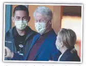  ?? ?? Clinton, with wife Hillary, leaves hospital.