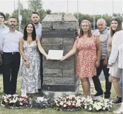  ??  ?? 0 Members of David Scott’s family with the new plaque beside Newton station. Left, Stuart Scott with the plaque and wreaths for his brother and the three others who died in the crash 30 years ago. Below, the aftermath of the train collision