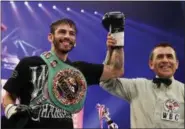  ?? KOJI SASAHARA — THE ASSOCIATED PRESS FILE ?? In this file photo, Jorge Linares of Venezuela celebrates after defeating Javier Prieto of Mexico during their 12-round scheduled vacant WBC Light weight title bout in Tokyo. Linares will fight Vasyl Lomachenko, of Ukraine, Saturday for Linares’ WBA...