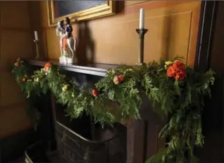  ??  ?? The Garden Club of Hamilton is decorating Dundurn Castle for Christmas. An upstairs mantel is decked out with fresh flowers and greenery.