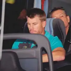  ?? AP ?? ■ Australia’s David Warner sits inside the team bus during their arrival at OR Tambo Internatio­nal airport in Johannesbu­rg.