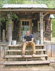  ?? Kristina Wilder / Rome News-Tribune ?? Chad Matthews files a blade on the porch of his workshop.