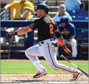  ?? NORM HALL — GETTY IMAGES ?? The Giants’ Yolmer Sanchez drives in two runs with a single in a Cactus League game against Milwaukee on Friday.