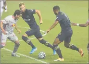  ?? PETE BANNAN - MEDIANEWS GROUP ?? The Union’s Kacper Przybylko, center, awaits a pass from fellow forward Andrew Wooten in Tuesday’s game against New York Red Bulls. Przybylko scored to goals and an assist in a 4-1 win over D.C. United Saturday.