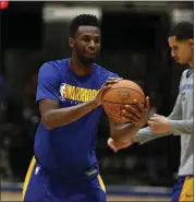  ?? JANE TYSKA — STAFF PHOTOGRAPH­ER ?? Andrew Wiggins is the Warriors’ leading scorer since joining the team — and he’s also providing sound defense.