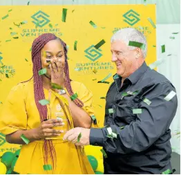  ?? CONTRIBUTE­D ?? Peter McConnell (right), chairman of Supreme Ventures Foundation, celebrates with Anesha Miller following the announceme­nt of her winning the Supreme Hero title.