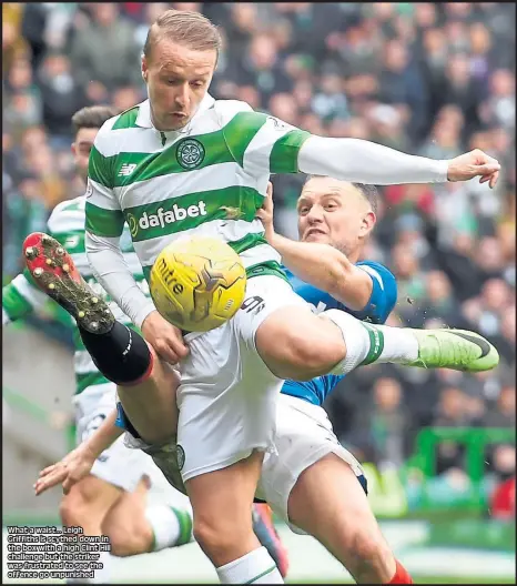  ??  ?? What a waist... Leigh Griffiths is scythed down in the box with a high Clint Hill challenge but the striker was frustrated to see the offence go unpunished