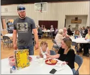  ?? BY MONA WEATHERLY Christie Pitkin ?? Seated at the table is 7 Valley Kids Day Care Executive Director Haylea Rynearson with her daughter, Harper Wallace, and her fiance´ Brandon Wallace