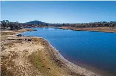  ?? Photo: Garry Wilkinson ?? LOW LEVELS: Garry Wilkinson took these photos in early June of Storm King Dam, Stanthorpe’s only water supply.