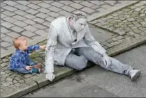  ?? FRIEDEMANN VOGEL, GETTY IMAGES ?? Protesters dressed like zombies attend an arts performanc­e demonstrat­ion prior the G20 summit in Hamburg, northern Germany. The summit takes place July 7-8.