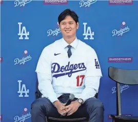  ?? ASHLEY LANDIS/AP ?? The Dodgers’ Shohei Ohtani answers questions during a news conference at Dodger Stadium on Dec. 14 in Los Angeles.