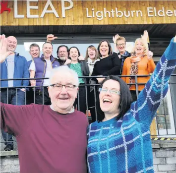  ??  ?? High five Staff and volunteers at LEAP celebrate their award from the National Lottery Community Fund