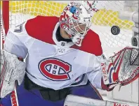  ?? CP PHOTO ?? Montreal Canadiens goaltender Antti Niemi gloves a loose puck in the third period of an NHL game against the Pittsburgh Penguins in Pittsburgh, Saturday, March 31.