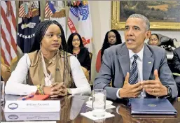  ??  ?? Making it about race: Black Lives Matter activist Brittany Packnett (left) with President Obama and civil-rights leaders at the White House.