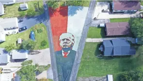  ?? PROVIDED PHOTO ?? J.R. Majewski, of Bay Township, who is running as a Republican candidate for Congress, has painted a huge Trump mural in his yard.