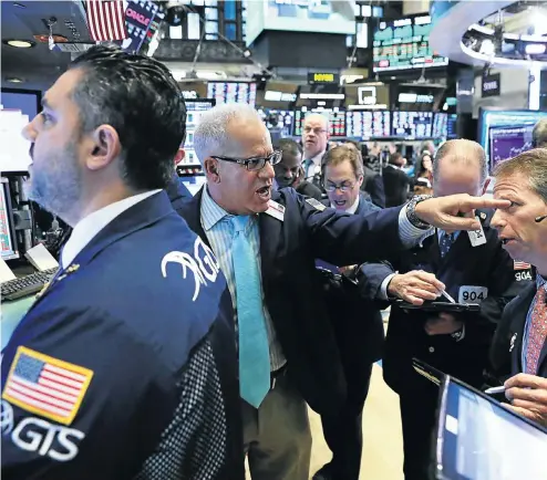  ?? Picture: Reuters ?? Traders at work on the floor of the New York Stock Exchange near the close of market in New York. US stocks rose on speculatio­n the month-long rout in equities had gone too far.