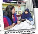  ??  ?? Ishrat Jahan, pictured her with her lawyer, was one of the crusaders in the tiple talaq fight