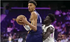  ?? Photograph: John Locher/AP ?? Victor Wembanyama drives around G League Ignite's Sidy Cissoko during a game on Tuesday. Cissoko is 6ft 8in.