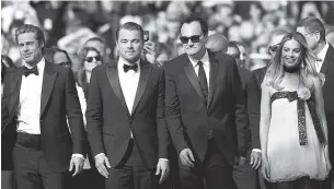  ?? AP PHOTO/PETROS GIANNAKOUR­IS ?? From left, actors Brad Pitt, Leonardo DiCaprio, director Quentin Tarantino and actress Margot Robbie arrive Tuesday at the premiere of Tarantino’s film “Once Upon a Time in ... Hollywood” at the 72nd internatio­nal film festival, Cannes, southern France.