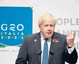  ?? JEFF J MITCHELL/GETTY ?? British Prime Minister Boris Johnson called the G-20’s commitment­s “drops in a rapidly warming ocean” Sunday in Rome. Scotland is hosting COP26.