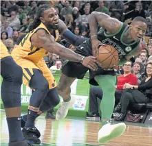  ?? JIM MICHAUD / BOSTON HERALD ?? GIVE ME THAT: Terry Rozier (right) tries to keep the ball away from Jae Crowder during the Celtics’ 98-86 loss to the Utah Jazz last night at the Garden.