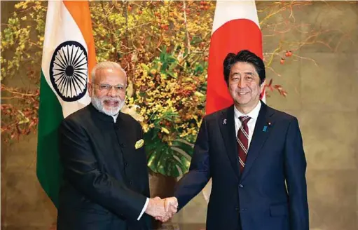  ??  ?? Prime Minister Narendra Modi with the Prime Minister of Japan Shinzo Abe in Tokyo, on November 11, 2016