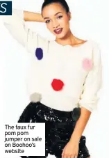  ??  ?? The faux fur pom pom jumper on sale on Boohoo’s website