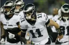  ?? JOHN FROSCHAUER — THE ASSOCIATED PRESS ?? Philadelph­ia Eagles quarterbac­k Carson Wentz warms-up before last Sunday’s game against the Seattle Seahawks in Seattle.