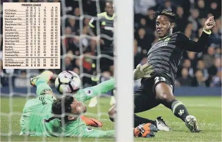  ??  ?? Michy Batshuayi pounces to hit home Chelsea’s title-winning goal at West Bromwich Albion last night.