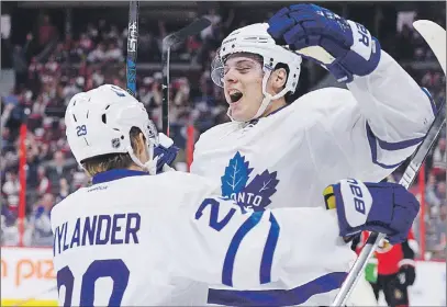  ?? CP PHOTO ?? Toronto Maple Leafs center Auston Matthews celebrates a first period goal with teammate William Nylander during NHL action earlier this season in Ottawa.