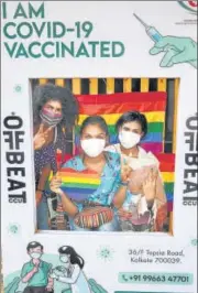  ??  ?? People pose for a photo after receiving the first dose of the Covid vaccine, in Kolkata on Sunday.