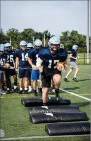  ?? JAMES BEAVER/FOR MEDIA NEWS GROUP ?? North Penn’s Nate Brown (17) works on his footwork at practice Monday morning at North Penn high school.