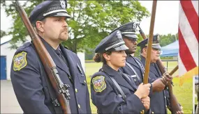  ?? Cassandra Day / Hearst Connecticu­t Media ?? Cromwell police took part in Edna Stevens School’s Flag Day observance.