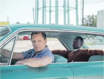  ?? UNIVERSAL PICTURES ?? Actors Viggo Mortensen, left, and Mahershala Ali star as an odd couple on a tour of the Jim Crow Deep South in the Oscar-touted Green Book, a new movie directed by Peter Farrelly.