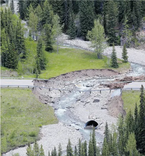  ?? PHOTOS: GAVIN YOUNG/ POSTMEDIA NEWS ?? This washout is one of many on Highway 40 near Highwood Pass bridge in Kananaskis Country after last week’s flooding.