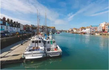  ??  ?? Above: the writer’s boat (right) moored in Weymouth. Left: squid, or calamari, is best dusted with cornflour and fried in hot vegetable oil