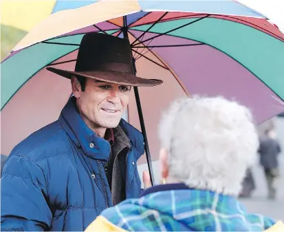  ?? ADRIAN LAM, TIMES COLONIST ?? Yannick Bisson shares a moment with longtime fan Bev Anderson during the shooting of a scene for the CBC television series Murdoch Mysteries at Cattle Point in Oak Bay on Friday.