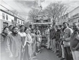  ?? AARON BESWICK ■ THE CHRONICLE HERALD ?? The Vedanta Ashram Society Hindu Temple held a chariot procession for the God Subramanya on Sunday. It drew hundreds.