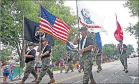  ?? [LORRIE CECIL] ?? An honor guard marching in the 2018 Pickeringt­on Fourth of July Parade