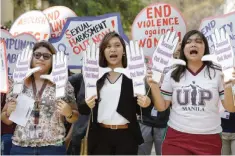  ??  ?? MANILA: Filipino students hold slogans against sexual harassment and alleged increase in cases of violence committed against young women during a rally outside their school in Manila, Philippine­s yesterday. The protest is part of events leading to the March 8 Internatio­nal Women’s Day. — AP