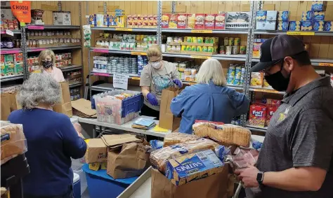  ?? (Special to The Commercial) ?? Volunteers Emily Lisenby (from left), Kathy Benton, Melissa Henley, Donna Curtis and Cy Cheney keep the White Hall Food Pantry stocked and organized.