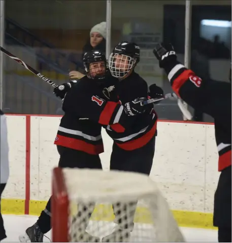  ?? Photos by Michelle Menard ?? Thanks to 36 saves from St. Raphael goalie Jeff Pimental, below, the No. 3 PSW co-op hockey team secured a 6-2 victory over No. 2 Ponaganset in Game 1 of their Division II semifinal series Friday night. Michael Barone (11, above) delivered a goal and an assist in the victory.