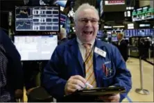  ?? RICHARD DREW — THE ASSOCIATED PRESS ?? Trader James Dresch works on the floor of the New York Stock Exchange, Thursday.