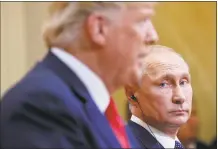  ?? Pablo Martinez Monsivais / Associated Press ?? Russian President Vladimir Putin, right, looks over toward U.S. President Donald Trump, left, as Trump speaks during their joint news conference at the Presidenti­al Palace in Helsinki, Finland, Monday.