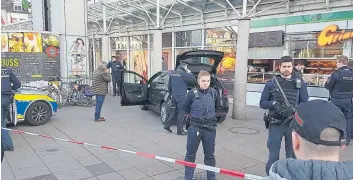  ??  ?? Police cordon off the scene of the car attack in Heidelberg, Germany