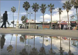  ?? Genaro Molina Los Angeles Times ?? A PASSING STORM left puddles on Windward Avenue in Venice earlier this month. Meteorolog­ists are “cautiously optimistic” that more rain is on the way.