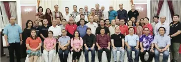  ??  ?? Mawan and Rayong (seated – fifth right and fifth left, respective­ly) in a photo-call with the delegates representi­ng the SDNU branches from Kuching, Samarahan and Serian divisions.