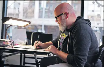  ?? [DOUG HOKE/THE OKLAHOMAN] ?? Oklahoma City comic book artist Jerry Bennett, who is the 2018-19 Skirvin artist in residence, works Monday in the ground-floor studio space in the historic downtown OKC hotel.